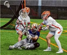  ?? Stephen Weaver/times Union archive ?? Bethlehem’s Luke Johnson, right, and Atticus Garcia fight for a loose ball with CBA goalie Ben Keens on Thursday. Johnson had four goals in the 11-10 win.