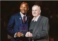  ?? Brad Horrigan / TNS ?? Former UConn standout Ray Allen and former head coach Jim Calhoun pose for a photo in 2019 at Gampel Pavilion in Storrs. Allen's number 34 was retired by the team.