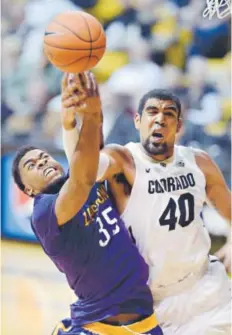  ?? Cliff Grassmick, Daily Camera ?? Lipscomb’s Martin Smith and CU’s Josh Scott battle for a rebound Sunday at the Coors Events Center. Scott finished with 29 points, 13 rebounds and five assists.
