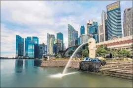  ?? Rustam Azmi Getty Images ?? “THE WHOLE society is now based on making money,” one professor said of Singapore’s courting of foreign wealth. “... It is at odds with our founding values.”