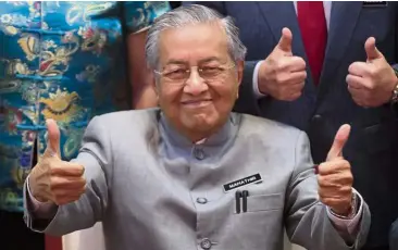  ?? — AP ?? All good: Dr Mahathir is hailed by many as the hero of New Malaysia but the writer believes that it is also imperative for youths to play a role in Malaysia’s democratic growth.