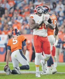  ??  ?? Kansas City Chiefs defensive end Emmanuel Ogbah celebrates a sack of Broncos quarterbac­k Joe Flacco on Oct. 17 at Empower Field at Mile High.