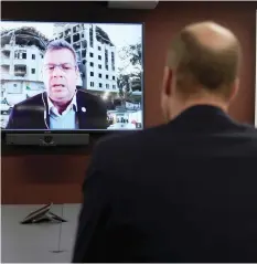  ?? (Kin Cheung/Reuters) ?? PRINCE WILLIAM listens to Pascal Hundt, senior crisis manager of the Internatio­nal Committee of the Red Cross, video calling from Gaza, during the prince’s visit to the British Red Cross at its headquarte­rs in London last week.