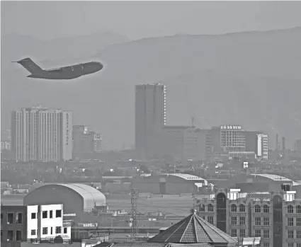  ?? AFP VIA GETTY IMAGES ?? A U.S. Air Force plane takes off from the military airport Friday in Kabul, Afghanista­n.