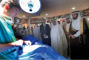  ?? —Photo by Dhes Handumon ?? Sheikh Hamdan bin Rashid taking a tour of the pavilions after inaugurati­ng the 42nd edition of Arab Health Exhibition & Congress at Dubai World Trade Centre on Monday.