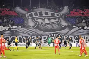  ?? ANDREJ ISAKOVIC/AGENCE FRANCE-PRESSE — GETTY IMAGES ?? A banner of a medieval Serbian ruler was meant to provoke the Albanian players at a recent match.