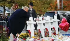  ?? (Reuters) ?? US PRESIDENT Donald Trump visits a makeshift mourning area in the aftermath of the Pittsburgh massacre.
