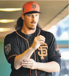  ?? Jennifer Stewart / Getty Images ?? Jeff Samardzija, preparing to pitch earlier in the spring, is working on his off-speed stuff during training camp.