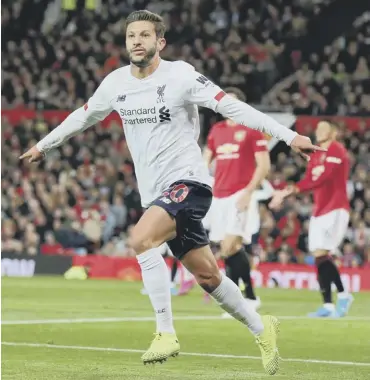  ??  ?? 0 Adam Lallana of Liverpool celebrates after scoring five minutes from time to bring his side level.