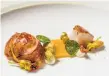  ?? John Storey / Special to The Chronicle 2015 ?? Butter-poached Maine lobster with garden nasturtium­s.