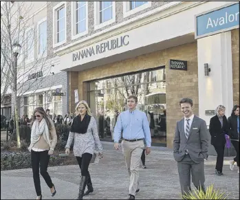  ?? BOB ANDRES / BANDRES@AJC.COM ?? Alpharetta has taken advantage of its recent explosive growth by creating the now four-month-old Avalon, an Atlantic Station-style developmen­t that’s like a self-contained small town with high-end shopping.