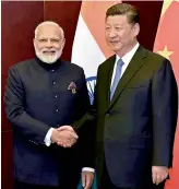  ?? — PTI ?? Prime Minister Narendra Modi and Chinese President Xi Jinping at the SCO Summit in Astana.