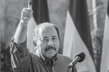  ?? Getty Images ?? Nicaragua’s President Daniel Ortega gives the thumbs-up to supporters after casting his vote in the municipal elections in Managua in 2017.