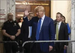  ?? YUKI IWAMURA – THE ASSOCIATED PRESS ?? Former President Donald Trump gestures to onlookers as he exits the courtroom in his civil business fraud trial at New York Supreme Court on Wednesday.