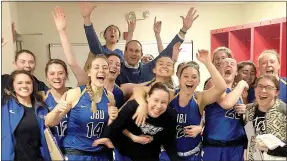  ?? Photo courtesy of John Brown University athletics ?? The John Brown women’s basketball team celebrated in the locker room Tuesday night after defeating Mid-America Christian 83-69 in the opening round of the Sooner Athletic Conference Tournament.