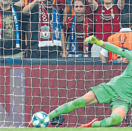  ??  ?? Liverpool goalkeeper Adrian saves Tammy Abraham’s penalty against Chelsea. Picture: Getty.