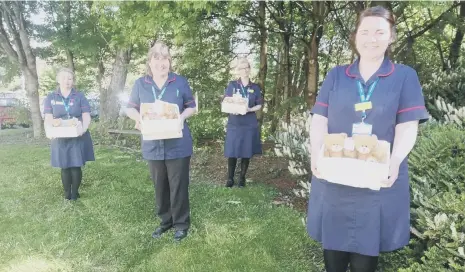  ??  ?? Specialist palliative care nurses, from left, Ashleigh Walton, Dawn Townsley, Bernadette Selby and Chantelle Forster with 4Louis gift boxes.