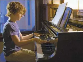  ?? Abramorama ?? JONAS BRODSKY, 11, works to learn the “Moonlight Sonata.” He was deaf by 4.