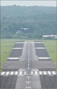  ?? H John Voorhees III / Hearst Connecticu­t Media ?? An airplane takes off from Danbury Municipal Airport into hazy skies on July 21 in Danbury, .