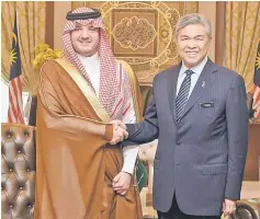  ??  ?? Zahid (right) welcomes Prince Abdulaziz Saud to his office in Bangunan Perdana Putra. — Bernama photo