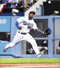  ?? (TNS) ?? LOS ANGELES DODGERS right fielder Yasiel Puig makes a running catch on a fly ball hit by the San Diego Padres’ Manuel Margot in the third inning of the Padres’ 4-0 road victory at Dodger Stadium on Tuesday night.