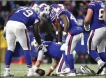  ?? ADRIAN KRAUS - THE ASSOCIATED PRESS ?? Buffalo Bills quarterbac­k Derek Anderson, bottom, is slow to get up after taking a hit from New England Patriots linebacker Kyle Van Noy, not pictured, during the second half of an NFL football game, Monday, Oct. 29, 2018, in Orchard Park, N.Y. Anderson left the game with an injury. The Patriots won 25-6.
