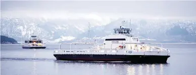  ??  ?? The MF Ampere, a zero-emissions ferry, sails between the villages of Oppedal and Lavik along the Sognefjord near Bergen on Wednesday, Feb. 21, 2018. While progress in electrifyi­ng the world’s excessivel­y polluting shipping fleets is miles behind...