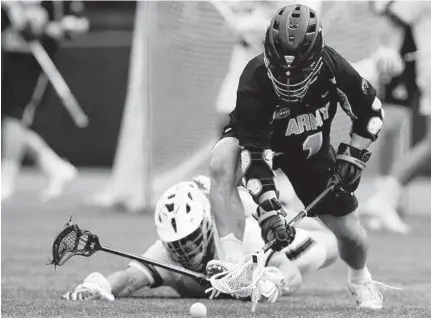  ?? DANIEL KUCIN JR./CAPITAL GAZETTE ?? Army’s Matt Manown attempts to gain possession during the Black Knights’ 100th men’s lacrosse meeting against Navy.