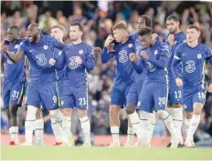  ?? — Reuters ?? Chelsea players celebrate during the penalty shoot-out against Aston Villa.