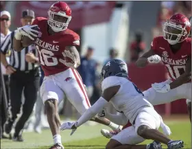  ?? (Special to the NWA Democrat-Gazette/David Beach) ?? Arkansas wide receiver Treylon Burks (left) caught 3 passes for 127 yards and a touchdown as the No. 20 Razorbacks defeated Georgia Southern 45-10 on Saturday afternoon at Reynolds Razorback Stadium in Fayettevil­le.