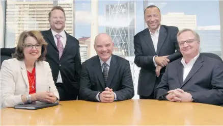  ?? Christina Ryan/Calgary Herald ?? Dylan Jones, CEO of Canada West Foundation, is surrounded by new management, from left, Janet Lane, Robert Roach, Carlo Dade and Len Coad. The revamped foundation will focus on helping Western Canada adapt to the new world economic realities.