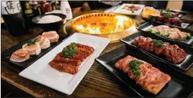  ??  ?? Ordering items to grill for Japanese barbecuing can add up quickly, but going to Gyu-kaku during happy hour results in lower prices that won’t break your bank.