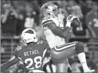  ?? The Associated Press ?? BUTLER DOES IT: Brice Butler (19) pulls in a touchdown reception as Arizona cornerback Justin Bethel defends during the second half of the Dallas Cowboys’ 28-17 road win over the Cardinals Monday night.