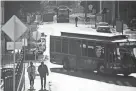  ?? CAITIE MCMEKIN/NEWS SENTINEL ?? Trolleys and pedestrian­s brave the cold in downtown Knoxville on Dec. 23, 2022. Temperatur­es are expected to dip into the single digits early next week with wind chill below zero.