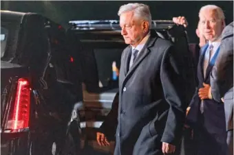  ?? AP PHOTO/ANDREW HARNIK ?? President Joe Biden, right, gets into a presidenti­al limousine with Mexican President Andres Manuel Lopez Obrador, left, as he arrives at the Felipe Angeles internatio­nal airport Jan. 8 in Zumpango, Mexico.