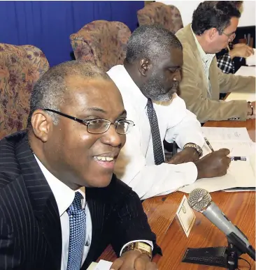  ??  ?? Deputy Chief Executive Officer of the Jamaica Informatio­n Service Ian Boyne (left) addresses government communicat­ors during a meeting at the Office of the Prime Minister on June 28, 2010. Others (from second left) are: Director General in the Ministry...