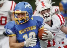  ?? PAul Connors / boston HerAlD ?? BIG WIN: Norwood’s Bryan Metayer runs away from Holliston’s Brady Sweeney on Saturday in Norwood.