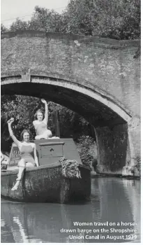  ??  ?? Women travel on a horsedrawn barge on the Shropshire Union Canal in August 1939