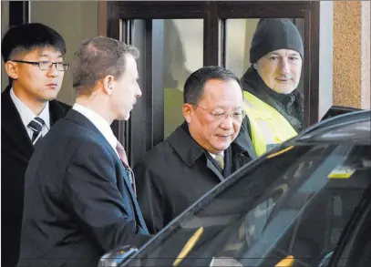  ?? Vilhelm Stokstad ?? The Associated Press North Korean Foreign Minister Ri Yong Ho, second right, leaves the Swedish government building Friday in Stockholm.