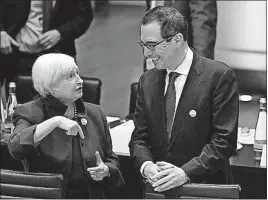  ?? [UWE ANSPACH/DPA] ?? Janet Yellen, chairwoman of the Federal Reserve, and U.S. Treasury Secretary Steven Mnuchin talk during the G20 finance ministers meeting in Baden-Baden, Germany. On Saturday, Mnuchin rebuffed German officials and rejected including in the meeting’s...