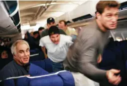  ?? Universal Pictures ?? Passengers rush toward hijackers who have taken over the jet leaving New Jersey on Sept. 11, 2001, in a scene from the film “United 93.”