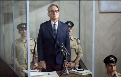  ??  ?? Adolf Eichmann (Ben Kingsley), the German Nazi SS-Obersturmb­annfuhrer who managed the logistics of the Holocaust, stands in a bullet-proof glass booth during his war crimes trial in Chris Weitz’ Operation Finale.