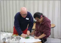  ?? ?? Spring Vegetarian Cooking Cuisine instructor Nicholas Petti and Willits High School student Rosa Andrade Diaz prepare food at Sanhedrin High School’s new cooking class.