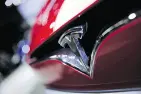  ??  ?? CHRISTOPHE ENA / THE CANADIAN PRESS FILES The Tesla logo on a Model S. A number of executives have left the firm’s finance department.