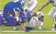  ?? BUTCH DILL/ASSOCIATED PRESS ?? Saints running back Alvin Kamara scores his sixth touchdown against the Vikings on Friday in New Orleans. Kamara tied a record set in 1929 as the Saints ran all over the Vikings in the win.