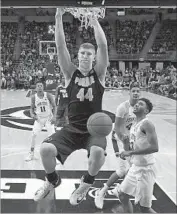  ?? Chris Knight Associated Press ?? ISAAC HAAS DUNKS for Purdue, which defeated Penn State for its sixth consecutiv­e victory.