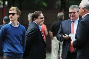  ?? ERICA MILLER/emiller@saratogian.com ?? Trainer Kiaran McLaughlin, middle, who has Carnival Court running in Saturday’s Alabama Stakes, talks in the paddock before the fourth race at the Saratoga Race Course.