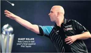  ??  ?? GIANT KILLER Rob Cross in last year’s final againstPhi­l Taylor