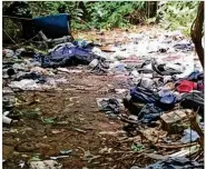  ?? FERENCHIK / THE COLUMBUS DISPATCH MARK ?? Trash litters an abandoned homeless camp just south of the Scioto River and east of Route 315 in Franklinto­n.