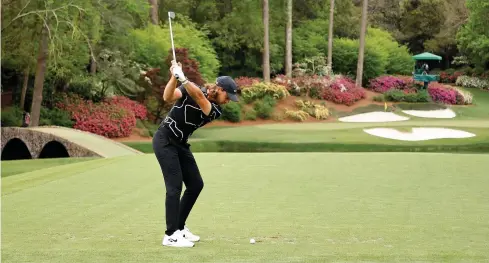  ?? Jared C. Tilton ?? ● Tommy Fleetwood plays his shot from the 12th tee during the first round of the Masters at Augusta